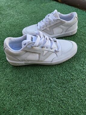 Vans Lowland CC sneakers in a white and gray colorway, featuring a slim profile